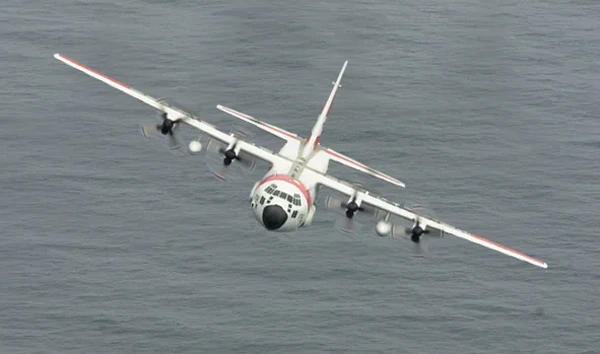C-130 Flying Over The Ocean